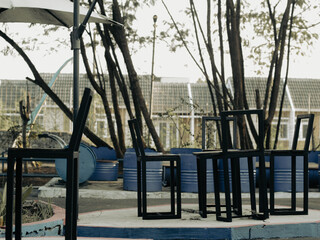 Fototapeta premium Empty black benches in a tourist park.