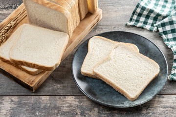 Slices of White Bread on wooden table