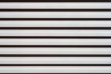 Obraz premium A close-up of a metal shutter with horizontal stripes