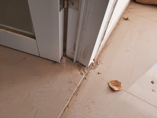 Modern aluminum door bottom with tile flooring, ideal for interior design or building materials...