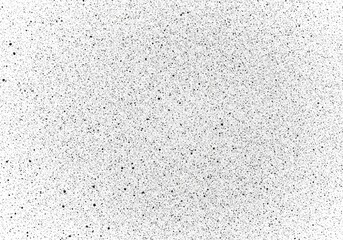 Obraz premium Dense speckled pattern of black dots on white background creates a textured effect