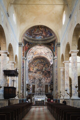 Reggio Emilia, Italy, 01.04.25. nterior view of historic Catholic church with frescoes and altar