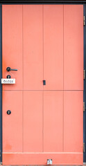 Bright pink door. Modern storefront. Cozy entry.
