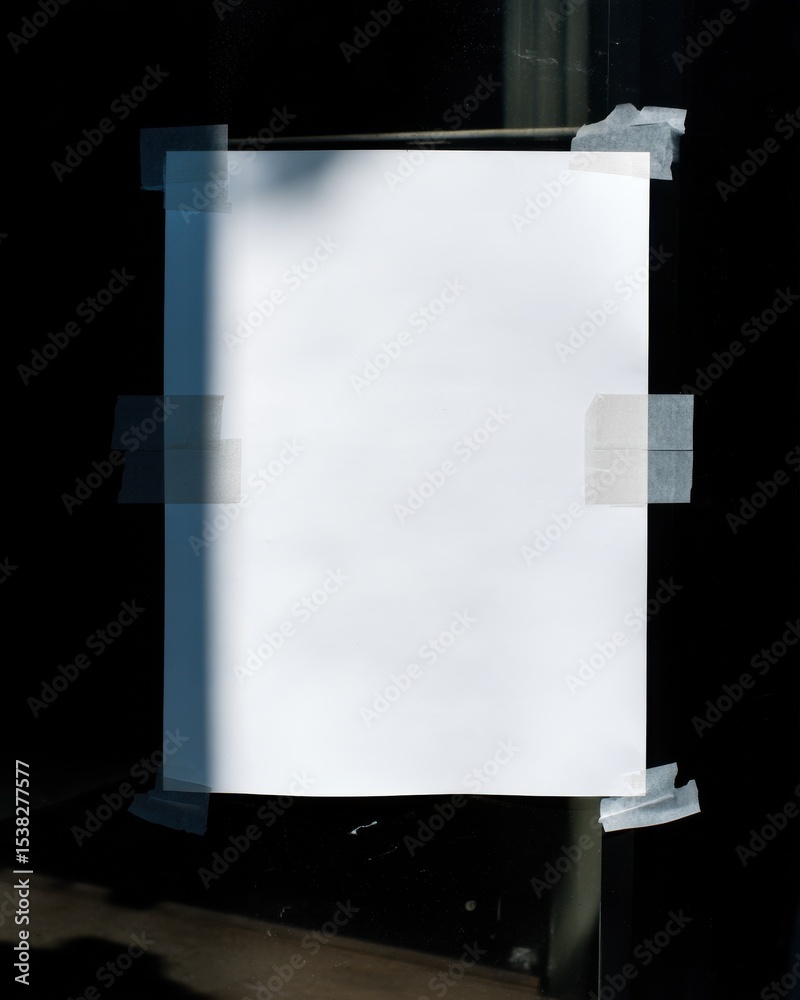 Aufkleber blank white paper taped to a dark surface, ideal for announcements and creative messaging, offering 