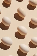 Fototapeta premium Beige eggs in a repeating pattern