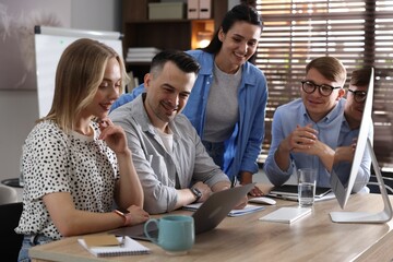 Marketing. Team of businesspeople working together at desk in office
