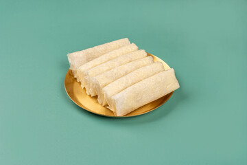 Traditional Indian Sugar Pootherekulu Mithai in a Brass Plate Arranged Beautifully Together