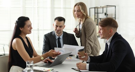 Marketing. Team of businesspeople working together at desk in office