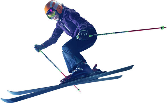 Female alpine skier wearing orange helmet and goggles performs jump with bent knees holding ski poles in dynamic flying position. Concept of training, energy and drive