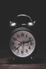 black alarm clock on a white background