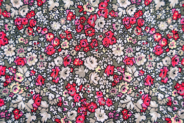 Red pink and white floral pattern on a green fabric texture background bg flowers