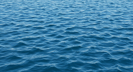 Calm and serene view of the open ocean water under the bright sunlight or daylight