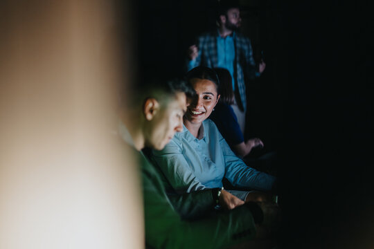 Diverse colleagues working together late at night. They are brainstorming and discussing projects in a collaborative business environment, emphasizing teamwork and strategic planning to meet deadlines