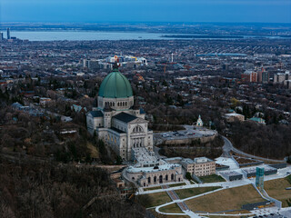 Fototapeta premium Aerial view of St. Josephs Oratory of Mount Royal at Sunset in winter. Montreal, Quebec, Canada