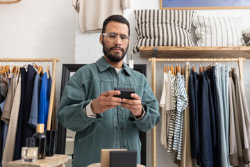 Man checking a product label in a boutique