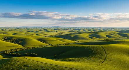 Stunning Aerial View of Rolling Green Hills Under a Blue Sky