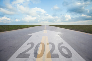Highway road to 2026. Empty road with written 2026 and arrow pointing towards the horizon.