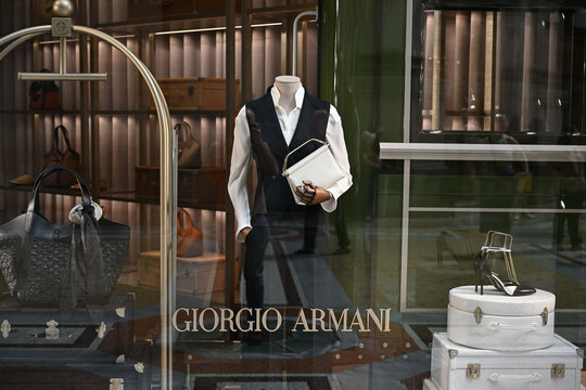 Milan, Italy - June 17, 2025: Products are seen on display in the Giorgio Armani boutique window in Galleria Vittorio Emanuele II ahead of Milan Fashion week taking place from June 20th to 24th