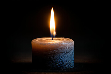 Single lit candle with quite flame