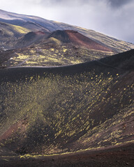 Exploring the Majestic Craters of Etna Park Under a Dramatic Sky in Sicily, Italy