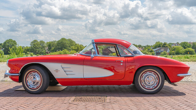 Lelystad, The Netherlands, 15.06.2025, Side view of the iconic american sports car Chevrolet Corvette C1 from 1961 at The National Oldtimer Day