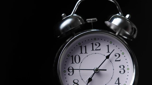 close-up of classic analog alarm clock showing