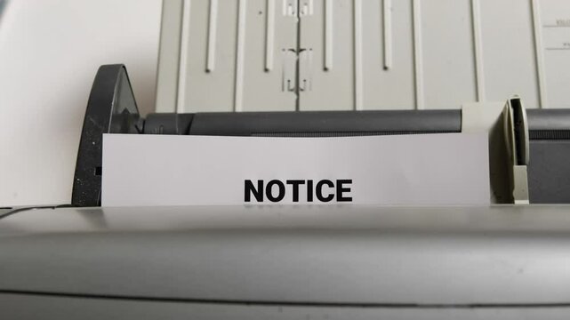 close-up of printer printing a termination of