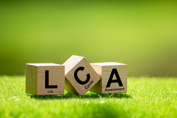 Growing sustainability. LCA-Life cycle assessment concept.LCA Text on a woodblock with a green...