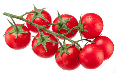 Red cherry tomatoes covered with water drops on branch isolated on white background.