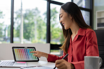 Female coder or developer working using a computer display in problem solving at workplace.