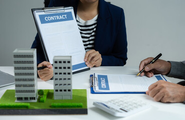 House model with agent asking costumer for contract to buy, get insurance or loan real estate or property.