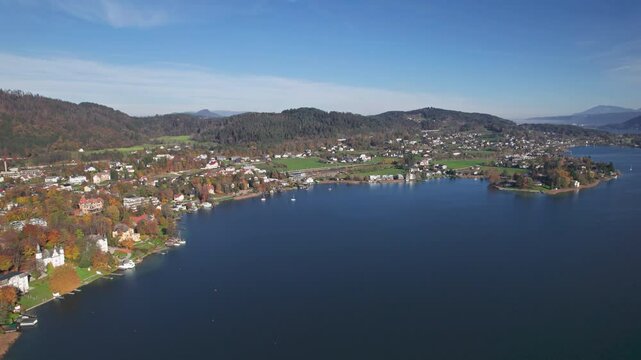 Flight over of Lake Worthersee and Portschach am Worther See at autumn, in Carinthia, Austria. 2x speeded up from 30 fps.