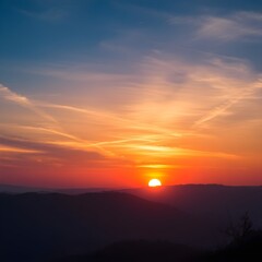 Breathtaking Sunset Over Mountain Horizon: Tranquil Evening Sky Colors

