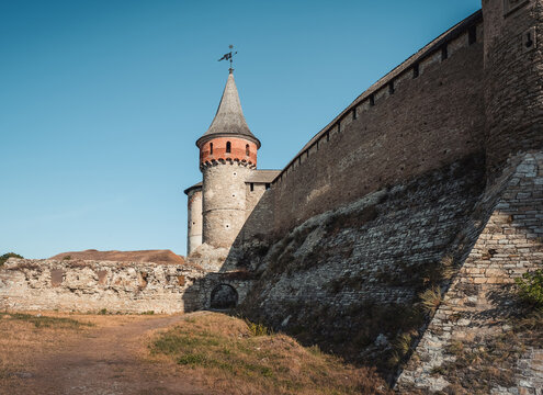 Kamianets-Podilskyi castle on a sunny day. Walls and Tenchynska tower of an old medieval fortress. Kamianets-Podilskyi, Ukraine - August 20 2015