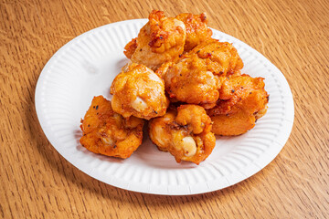 Delicious, crispy fritters piled high, bursting with rich flavors that invite you to enjoy