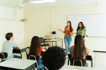 High school students giving presentation in classroom