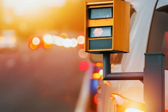 Speed camera flashes yellow light for speeding car