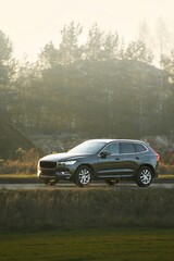 Family vehicle driving on highway through countryside