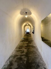 Textured White Corridor Leading into Distance