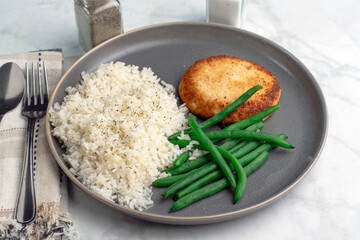 salmon patty  with rice and string beans