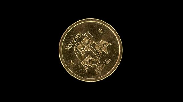 Sweden 2003 10 kronor coin reverse featuring three crowns value and royal motto rotating on black background