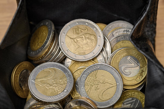 A purse with euro and Polish zloty coins