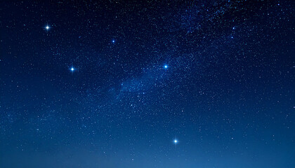 Starry Night Sky with Blue Glowing Stars Background in the Darkness of Night

