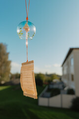 Summer Scene with Wind Chime and Blue Sky