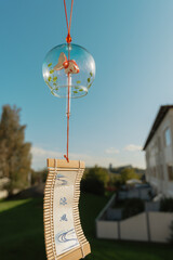Summer Scene with Wind Chime and Blue Sky