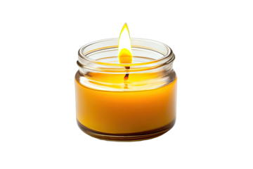 Small, round, amber candle in a glass jar, with a lit wick