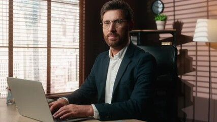 Caucasian middle-aged business man typing laptop in office smiling looking at camera mature businessman working computer online chatting consulting client internet job male employer happy at table - Powered by Adobe