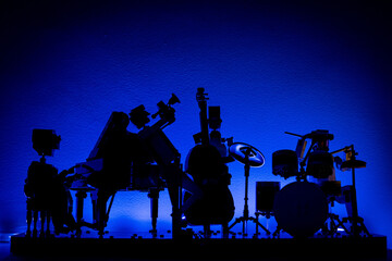 silhouettes of brick people on concert
