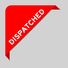 Red color of corner label banner with word dispatched on gray background