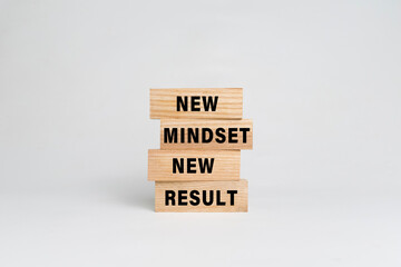 new mindset new result words text on wooden blocks isolated on white background